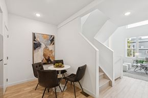 Philadelphia apartment for rent - A dining room with a table and chairs and a painting on the wall.