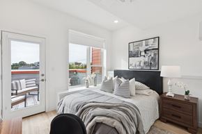 Philadelphia apartment for rent - A bedroom with a large bed and a view of the outside.