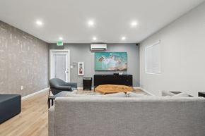 Fremont apartment for rent - A bedroom with a bed, chair, and painting on the wall.