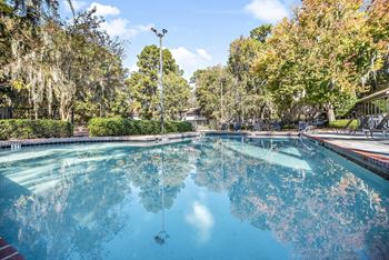 Resort-style pool with lounge seating