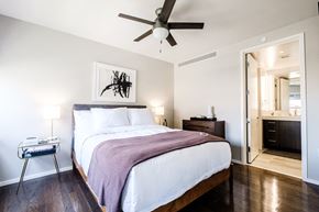 Dallas apartment for rent - a bedroom with a bed and a ceiling fan