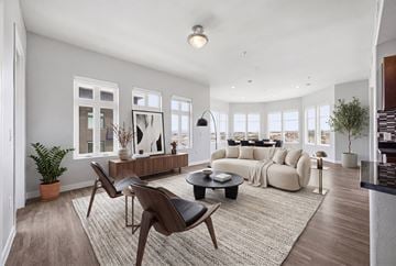 Las Vegas apartment for rent - A living room with a white sofa and a black coffee table.