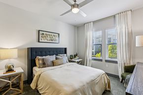 Odessa apartment for rent - Spacious bedroom with large windows and ceiling fan at Lotus at Starkey Ranch in Odessa, Florida.