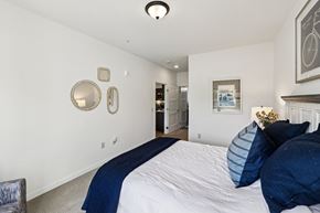 Blaine apartment for rent - A bedroom with a large bed and a painting on the wall.