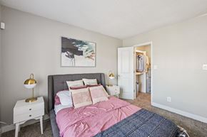 Glendale apartment for rent - A bedroom with a bed, nightstand, and a painting on the wall.