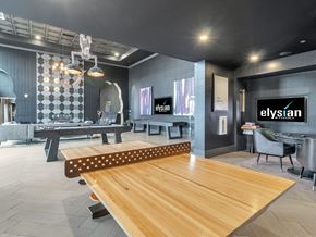 Las Vegas apartment for rent - A modern dining room with a wooden table and chairs.