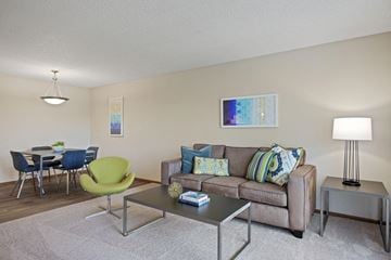 Coon Rapids apartment for rent - a living room with a couch and a table
