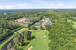 Richmond Hill townhouse for rent - A golf course with a clubhouse and several houses in the background.