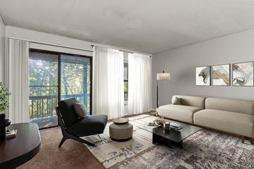 Macon apartment for rent - A modern living room with a black chair and a beige sofa.