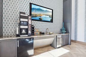Las Vegas apartment for rent - a kitchen with a coffee machine and a picture on the wall