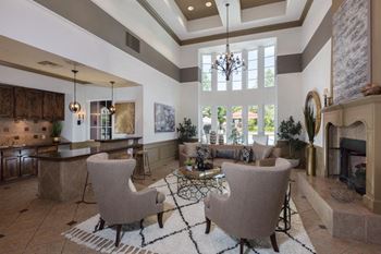 Elegant clubroom with kitchen, fireplace, & tv