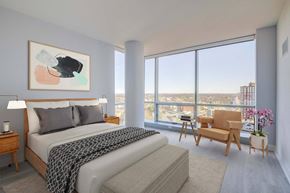 New Rochelle apartment for rent - 3thirty3 new rochelle ny apartment high rise photo of bedroom with large windows and modern furnishings