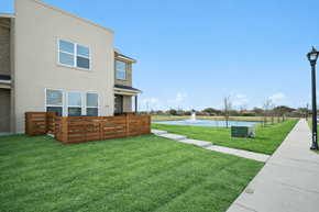 Melissa townhouse for rent - A residential building with a pool in the backyard.