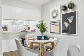 Jacksonville apartment for rent - A dining room with a table set for two and a potted plant on the table.
