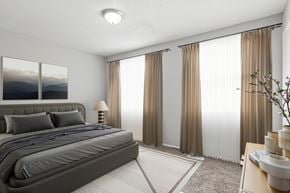 Macon apartment for rent - Element at 4411 Macon Apartments A bedroom with a large bed and a painting on the wall.