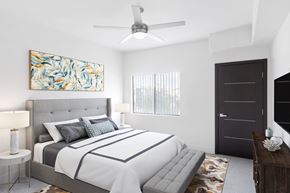 Henderson apartment for rent - A bedroom with a large bed and a painting on the wall.