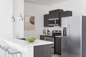Las Vegas apartment for rent - a kitchen with stainless steel appliances and a white counter top