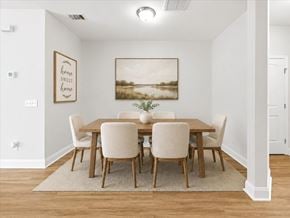 Richmond Hill townhouse for rent - A dining room with a wooden table and chairs.