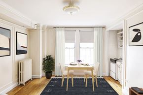 Brookline apartment for rent - Cozy dining area with a small table set for two, adjacent to a compact kitchen.