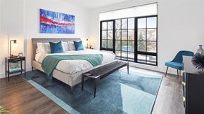 Mamaroneck apartment for rent - Light filled bedroom with floor to ceiling windows and modern furnishings