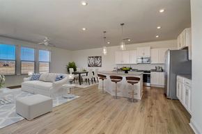 Sherrills Ford townhouse for rent - A modern kitchen with white cabinets and a wooden floor.