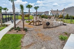 Summerville townhouse for rent - A playground with a slide and tire swing set.