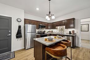 Blaine apartment for rent - A kitchen with a table and chairs in the middle.
