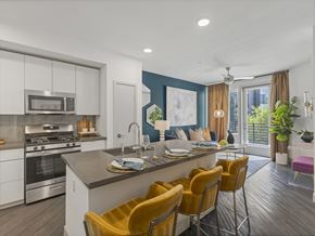 Las Vegas apartment for rent - A modern kitchen with a dining table and chairs.