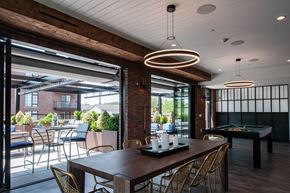 Mamaroneck apartment for rent - a dining room with a table and chairs and a pool table