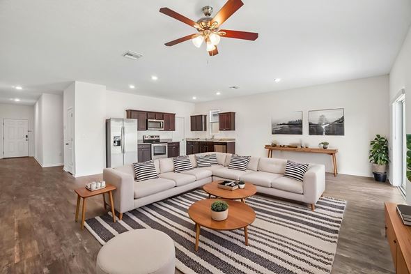 Lakeland apartment for rent - A living room with a striped rug and a white couch.
