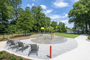 Charlotte apartment for rent - Outdoor splash pad and seating area at Somerset Apartments in Charlotte, NC, perfect for residents of studio, 1, 2, and 3 bedroom apartments