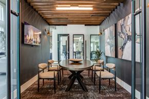 College Station apartment for rent - a dining area with a wooden table and chairs