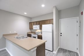 Grain Valley apartment for rent - a kitchen with white appliances and a white refrigerator