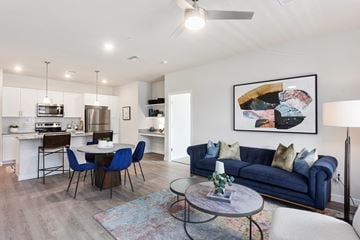 Glendale apartment for rent - a living room with a blue couch and a round table