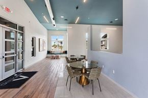 Glendale apartment for rent - a dining room with a glass table and chairs