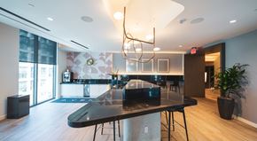 Los Angeles apartment for rent - A modern dining room with a black table and chairs.