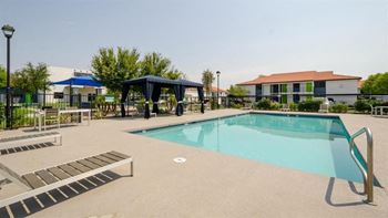 Two pools with spas, cabanas, and grills