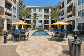 Las Vegas apartment for rent - A large courtyard with a pool surrounded by apartment buildings.