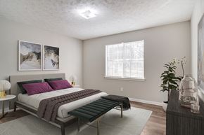 Pine Lake apartment for rent - Affinitee at Pine Lake Apartments in Pine Lake, GA photo of a bedroom with a bed and a window