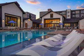 Castle Rock apartment for rent - 1-Bedroom Apartments in Castle Rock, CO - Alana - Resort-Style Pool with Lounge Chairs, Umbrellas, and Daybeds