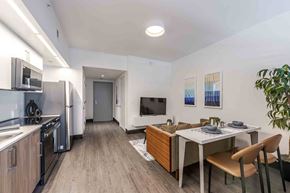 Miami Beach apartment for rent - Open-concept living room, dining area, and kitchen in a modern, pet-friendly Miami Beach apartment featuring energy-efficient appliances, sleek finishes, and natural lighting.