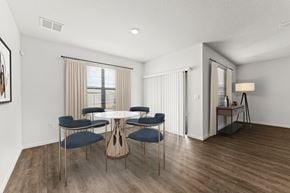 Palm Bay townhouse for rent - A dining room with a round table and chairs.