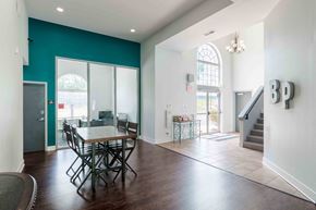 Grain Valley apartment for rent - a dining room with a table and chairs and a staircase