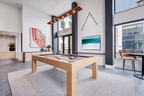 San Francisco apartment for rent - a billiards table in the clubhouse of a building with large windows