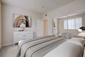 Sacramento apartment for rent - 3-Bedroom Apartments in Sacramento, CA - Avanti - Bedroom with Plush Carpeting, Full-Size Bed, Dresser, Double Mirror Closet Doors, and Wall Art