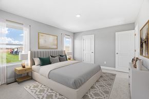 Maple Grove apartment for rent - A bedroom with a large bed and a painting on the wall.