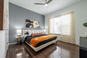 Oviedo apartment for rent - a bedroom with a bed and a ceiling fan