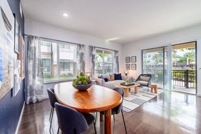 Oviedo apartment for rent - a living room with a dining room table and a balcony