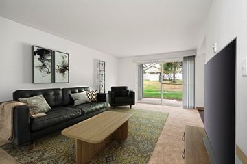 Everett apartment for rent - a living room with a couch and a coffee table and a tv