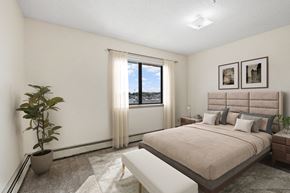Coon Rapids apartment for rent - a bedroom with a bed and a window
